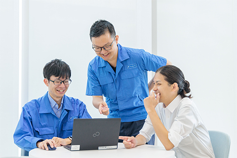 Three team members chatting about technology under development